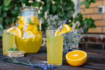 cold drink summer lemonade of oranges and mint with lavender