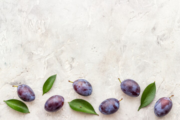 Purple cherry plums layout. Food fruits background. Top view