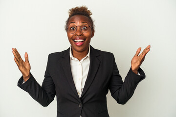 Young business african american woman isolated on white background receiving a pleasant surprise, excited and raising hands.