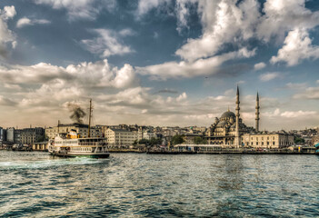 Fototapeta na wymiar Yeni Mosque view from sea in Istanbul. İstanbul is populer tourist destination in Turkey.