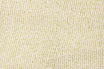 Raw dried semolina background, texture, horizontal grooves, top view