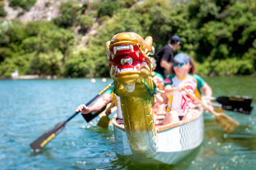 Close-up of dragon boat with crew