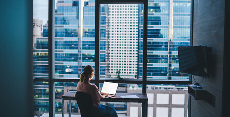 Woman working on laptop during workday