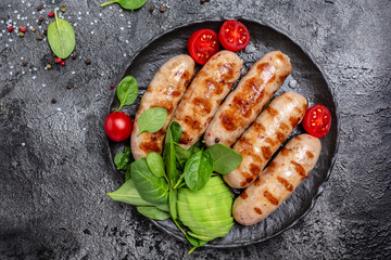 Delicious sausages grilled, Ketogenic diet. Healthy fats, clean eating for weight loss. Keto paleo diet menu. top view