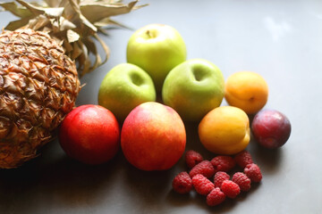 Various colorful fruit on dark background. Selective focus.