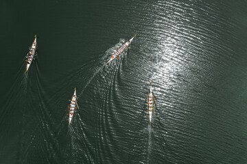 Top view of four dragon boats racing