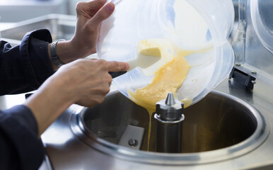pouring the mixture into ice cream machine