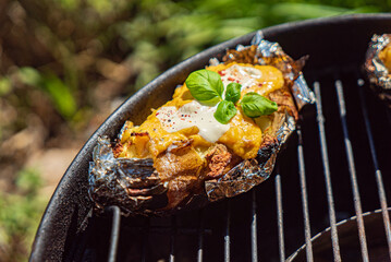 grilled potato with cheese and herbs