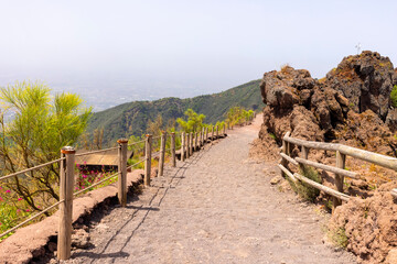 Scenic footpath made of fine sharp volcanic tuff to the top of the Vesuvius volcano, Mount...