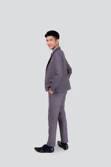 Rear view of young asian businessman in suit hand in pocket with confident isolated on white background, back of business man is manager or executive or employee thinking with success, full length.