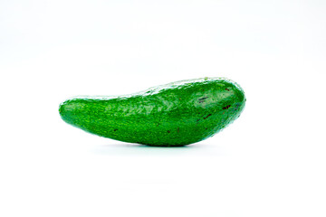 Raw green avocado isolated on white background.