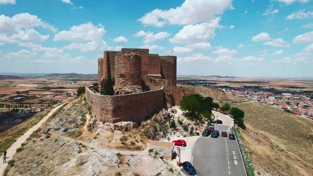 Drone point panorama view Castle of La Muela in Consuegra historic town during sunny cloudy day. Province of Toledo, Castile-La Mancha, Spain. Heritage, landmarks concept