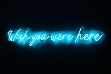 neon sign 'wish you were here'
