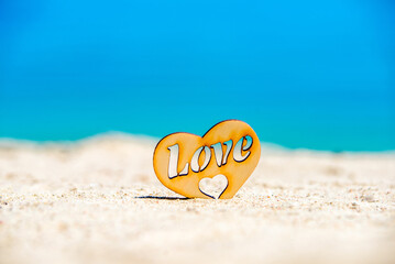 romantic symbol of heart on the beach