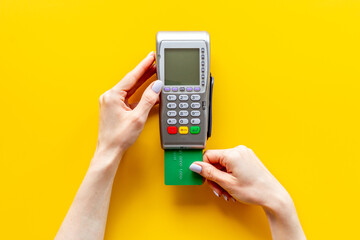 Hand paying by card with pos payment terminal. Payment transactions concept