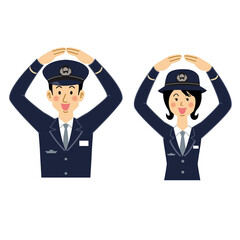 okポーズをする鉄道員の男女