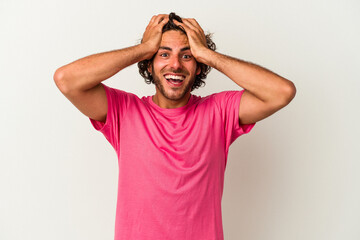 Fototapeta premium Young caucasian man isolated on white background screaming, very excited, passionate, satisfied with something.