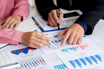 Business meeting time,business account managers crew working with new startup project,report analysis cost graph on desk at meeting room.