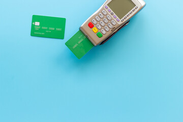 Fototapeta premium Payment by credit card with POS terminal, top view. E-commerce and payment concept