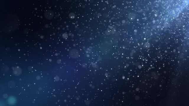 Seamless background animation of slowly flying dust particles on a blue background with shallow depth of field. Abstract dark particle looped background futuristic concept with bokeh. Motion graphic