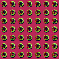 Summer fresh juicy appetizing berries on a plate on a pink rich background. Seamless pattern.