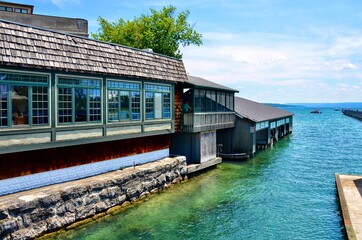 Waterfront buildings, restaurant and boathouses, on the  the Skaneateles Lake. It’s one of Finger Lakes in New York. 