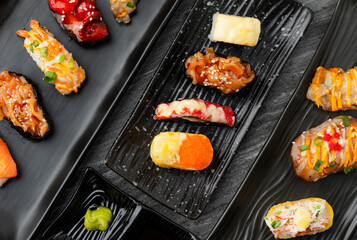 Japanese sushi set in ceramic empty plate dark Placed on the table concrete grunge texture background., Top view flat lay