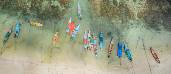 Long Tail Boats Tied Up In Shallow Water on Sairee Beach, Koh Tao, Thailand