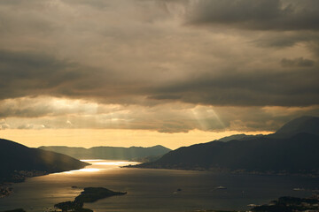 Obraz premium View of the Tivat Bay and the airport runway. Sunset in the Tivat Bay