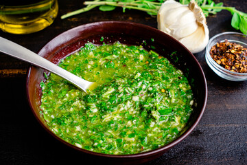 Bowl of Fresh Chimichurri Sauce: A closeup view of freshly made chimichurri
