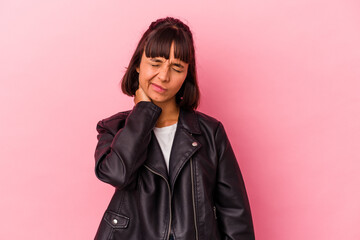 Young mixed race woman isolated on pink background having a neck pain due to stress, massaging and touching it with hand.