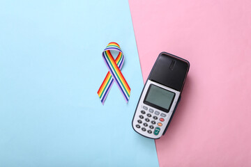 Pos terminal and LGBT rainbow ribbon pride tape symbol on pink blue background