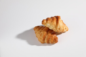 Croissant isolated in  wihite background with sunny light