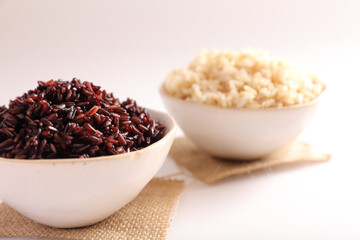 Organic boiled brown rice on bowl isolated in white background
