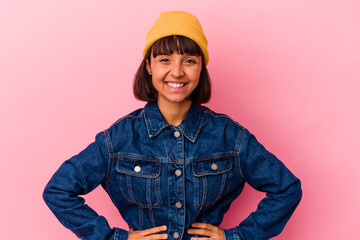 Young mixed race woman isolated on pink background happy, smiling and cheerful.