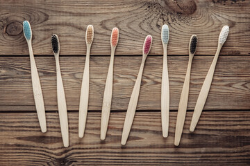 Eco bamboo toothbrushes on wooden background