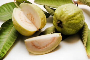 fresh guava fruit (tropical fruit) with slice isolated on white background.