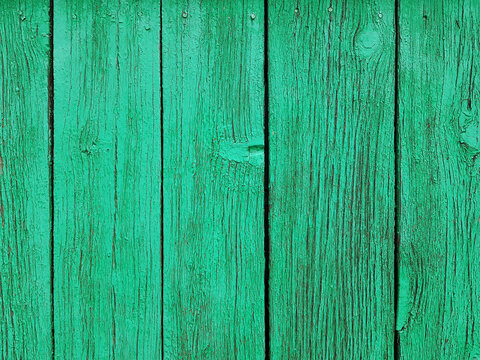 green wooden fence made of planks