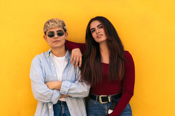 Two beauty young girls posing and looking at camera