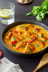 Chicken tikka masala curry with herbs and peppers. Indian food. National cuisine.