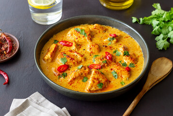 Chicken tikka masala curry with herbs and peppers. Indian food. National cuisine.