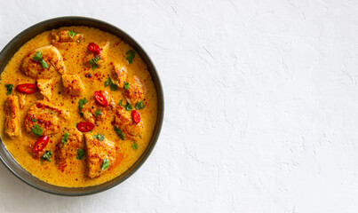 Chicken tikka masala curry with herbs and peppers. Indian food. National cuisine.