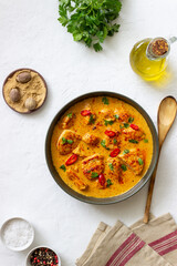 Chicken tikka masala curry with herbs and peppers. Indian food. National cuisine.