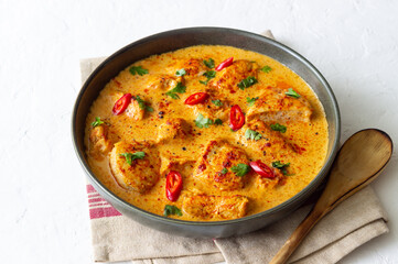 Chicken tikka masala curry with herbs and peppers. Indian food. National cuisine.