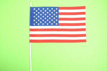American flag on a green background.