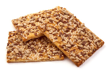 Wholegrain crispy bread with sunflower, linen and sesames seeds, isolated on white background. High resolution image.