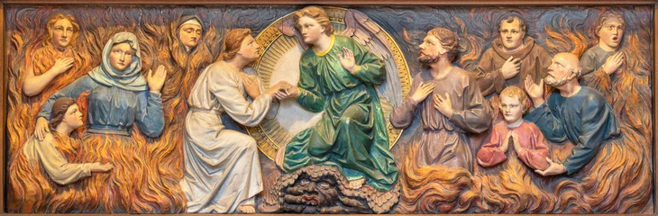 Foto auf Glas VIENNA, AUSTIRA - JUNI 24, 2021: The relief of Help of prayer to the Souls in purgatory in the church Marienkirche by unknown artist from end of 19. cent. © Renáta Sedmáková