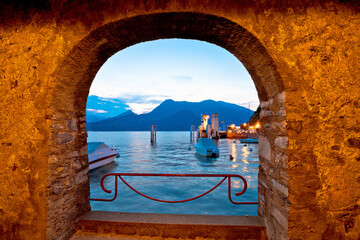 Town of Varenna lakefront evening view through stone window evening view, Lake Como