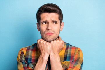 Portrait of attractive miserable confused guy bad mood fail failure isolated over bright blue color background