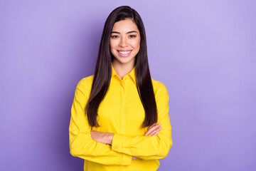Photo of cheerful young lovely lady good mood smile hold hands crossed isolated on purple color background